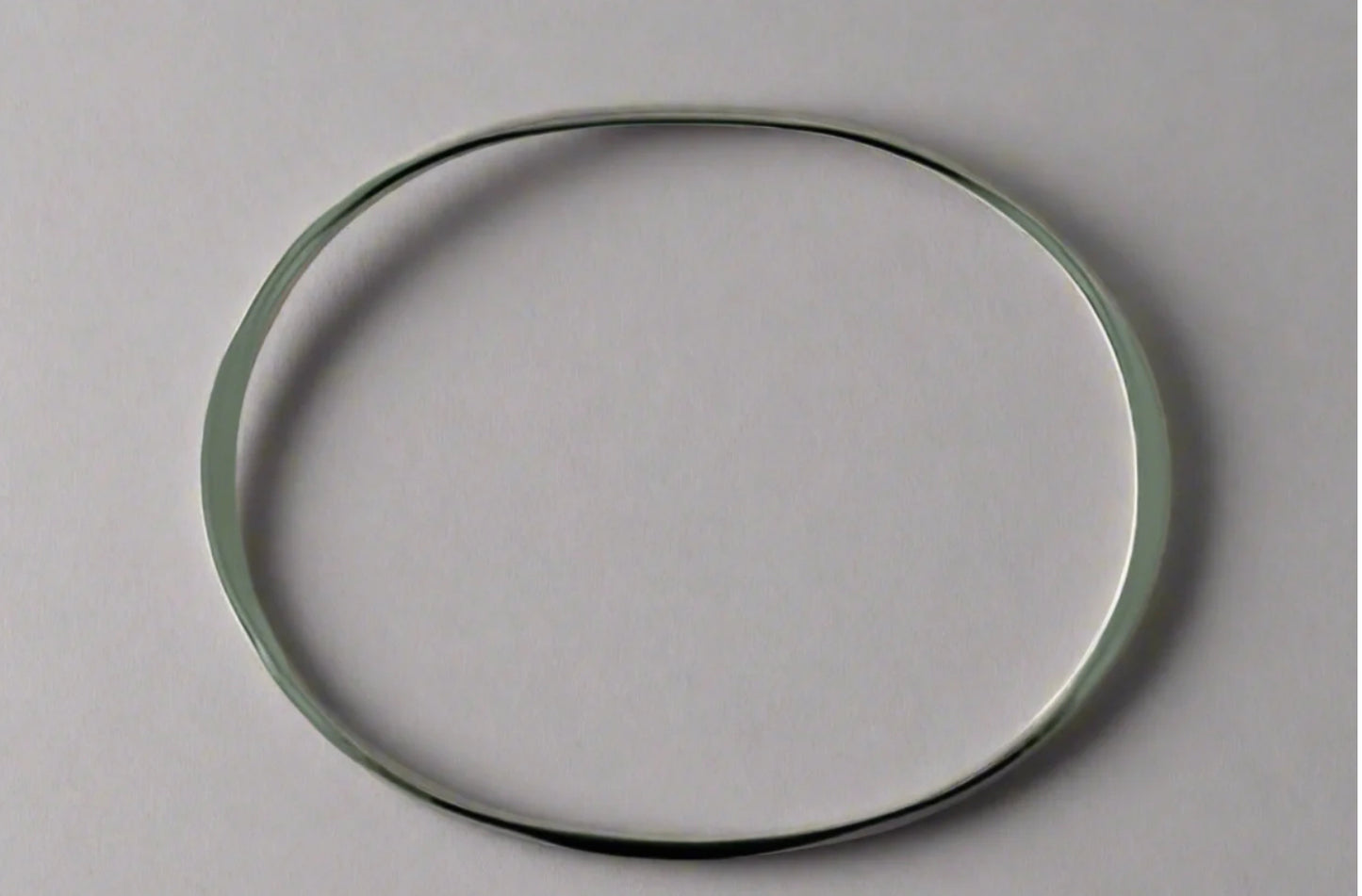 STERLING SILVER NARROW FLATTENED OVAL BANGLE
